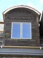 Dormer Clad with Picklewood / This dormer is clad with Weathered Picklewood Wedge-Lap siding Dormer Clad with Picklewood / This dormer is clad with Weathered Picklewood Wedge-Lap siding
